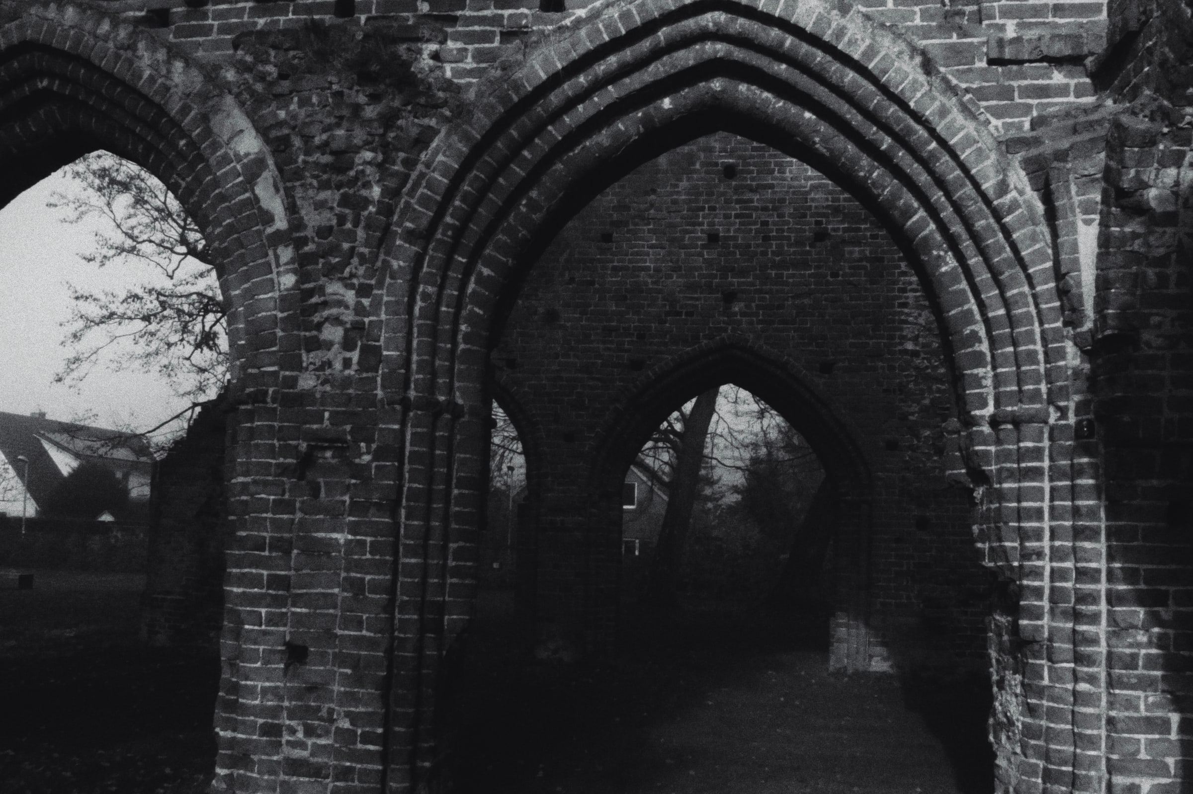 Brick Gothic arches over grass