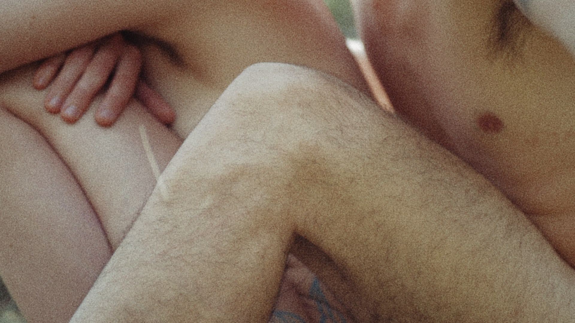 Intertwined arms and legs, skin in close-up