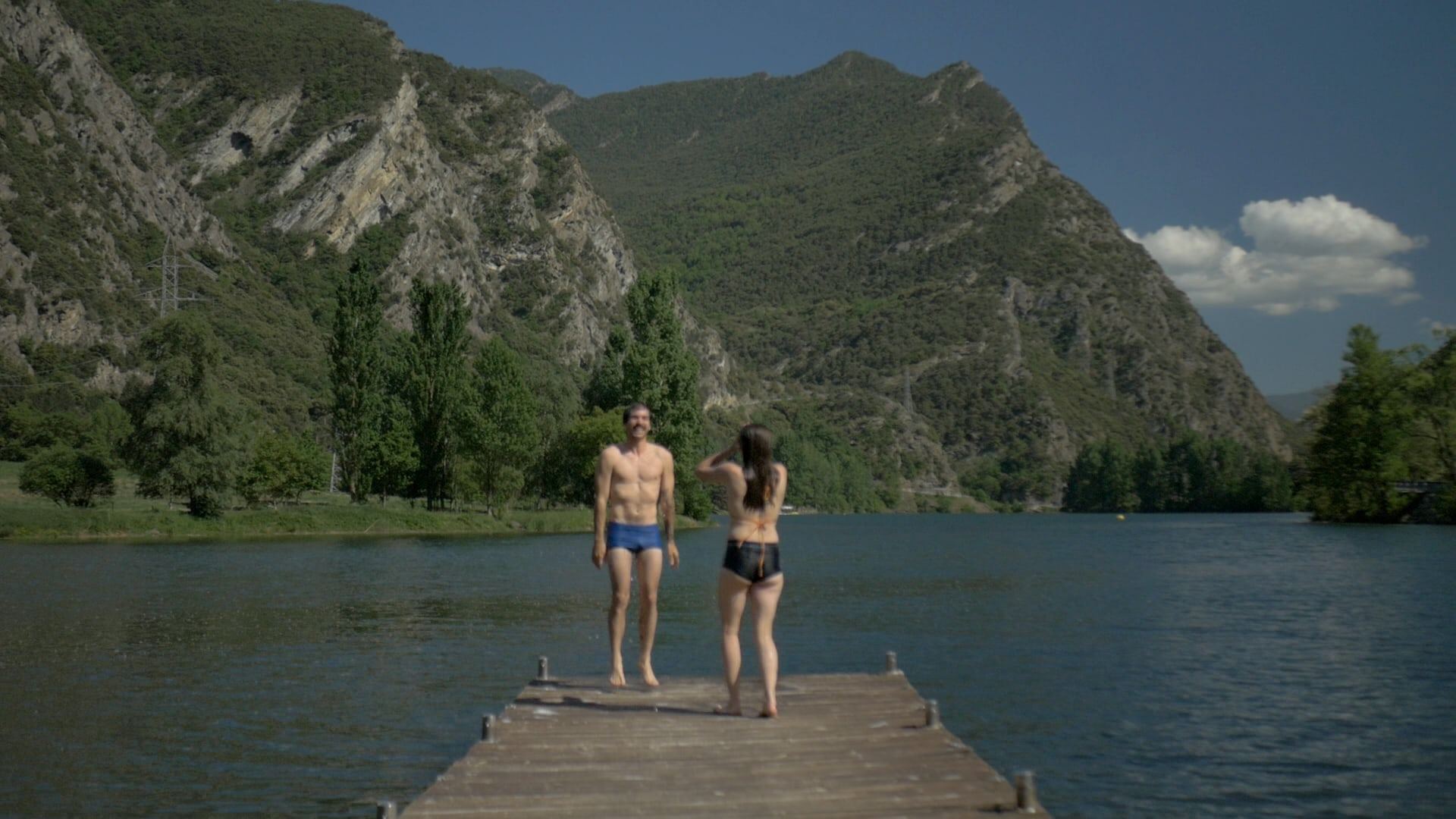 Two people on a jetty by the lake, second frame